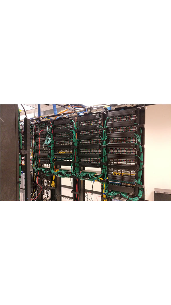 A bunch of wires hanging on the wall