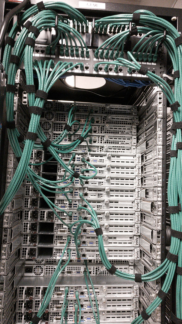 A large rack of wires in the middle of a room.