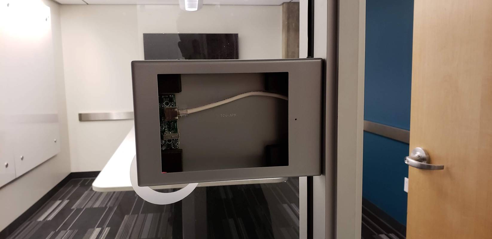 A television is hanging on the wall.