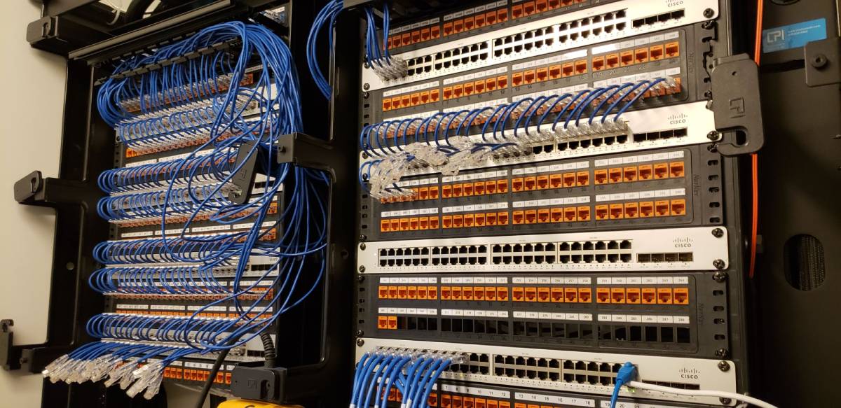 A bunch of wires are connected to the wall