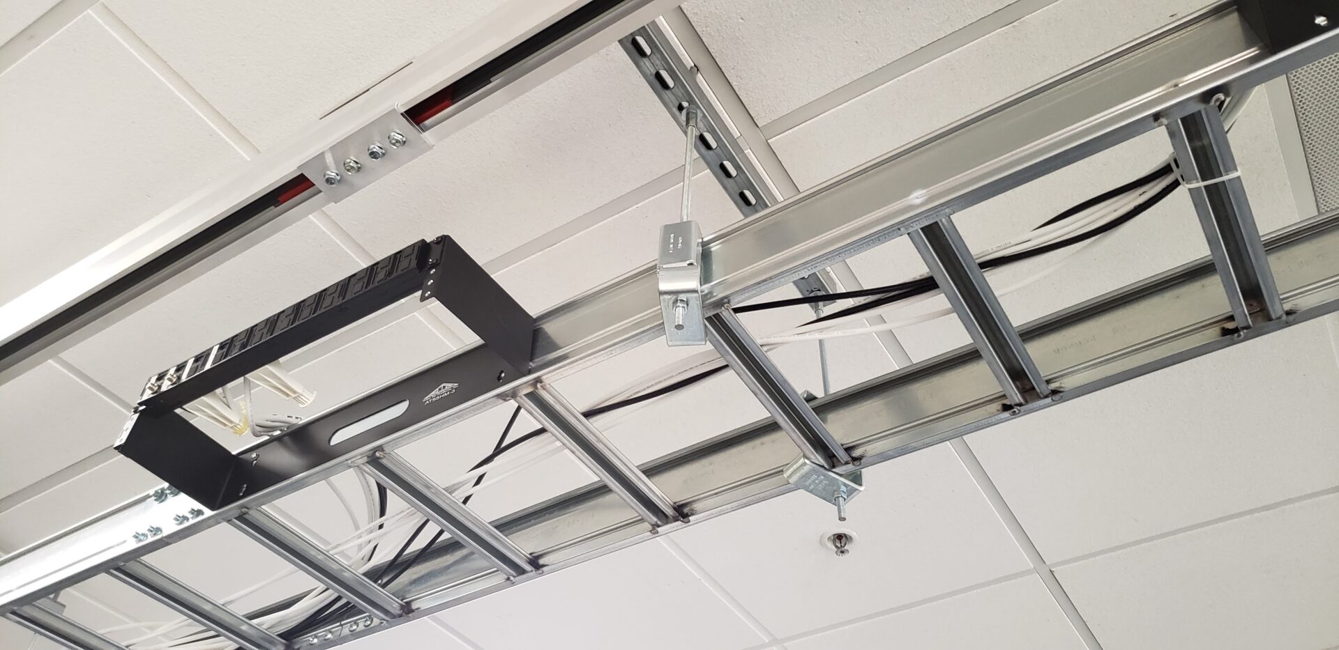 A ceiling with many parts hanging from it