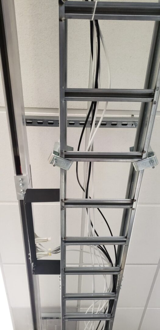 A ladder hanging from the ceiling of a room.