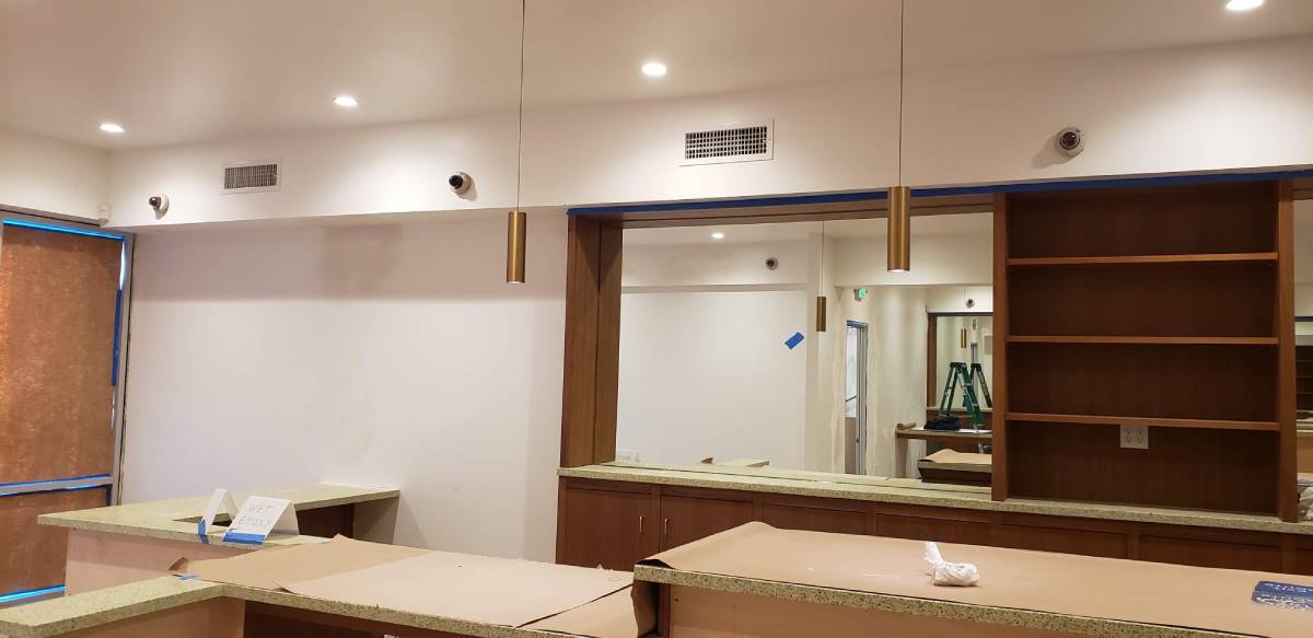A kitchen with a mirror and some lights