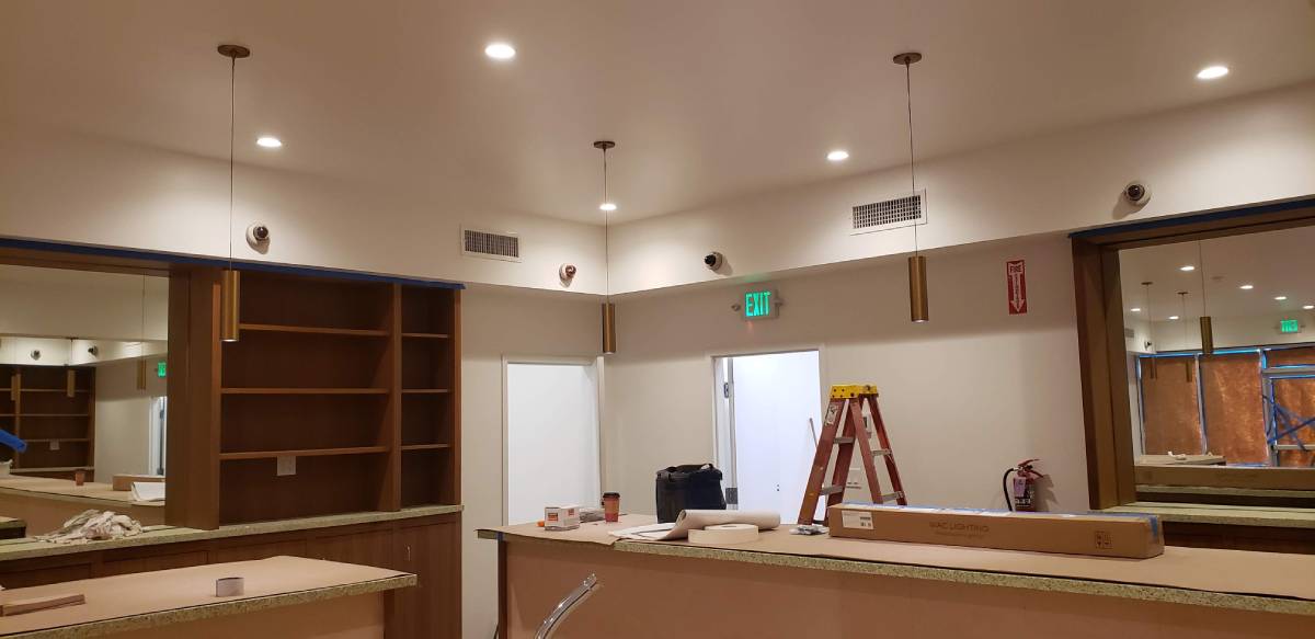 A room with a ladder and some lights