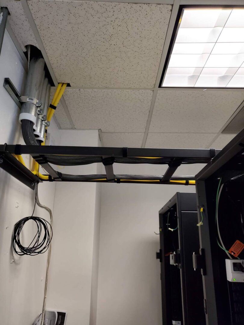 A room with two black cabinets and a yellow line